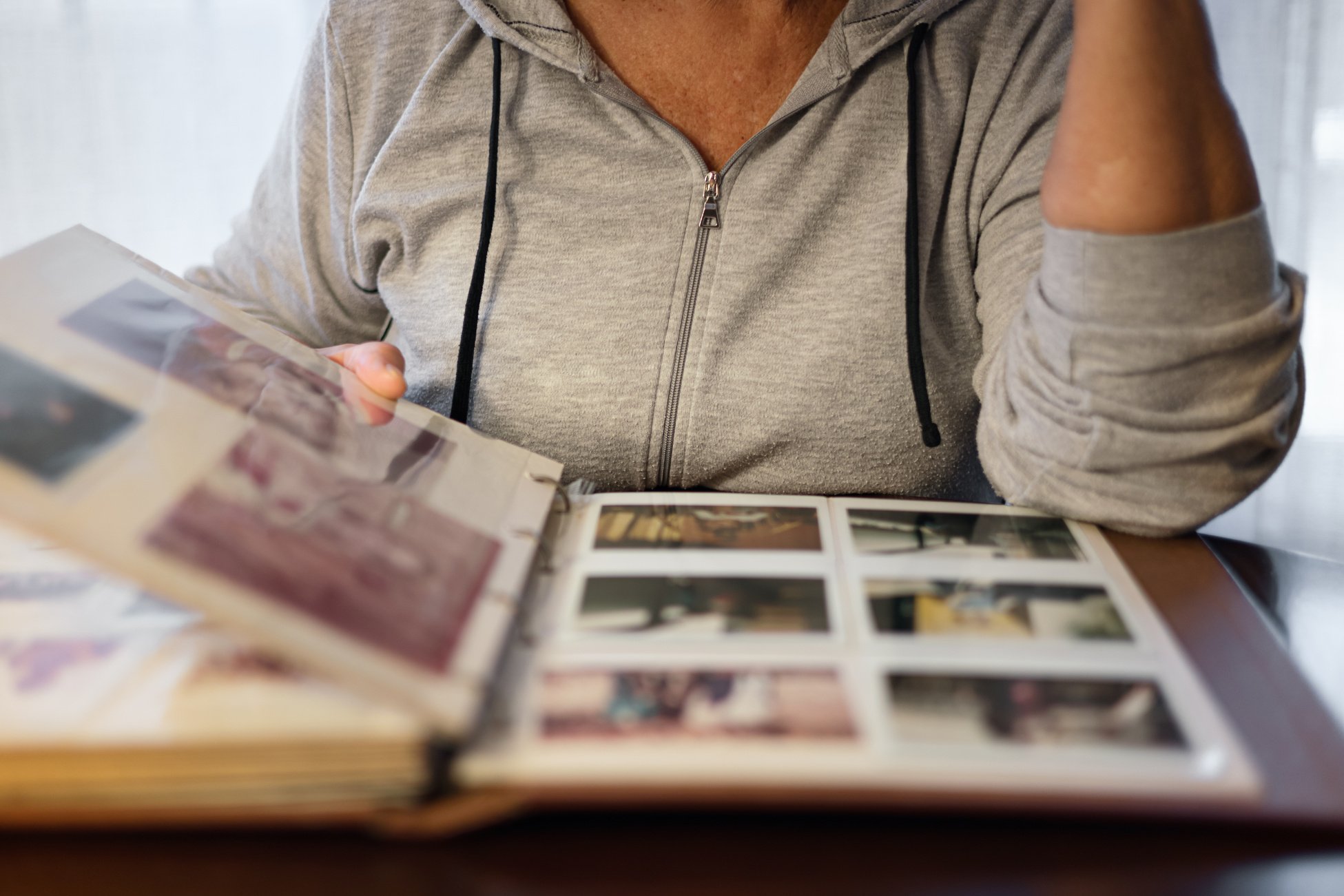 Old woman looking at  photo album